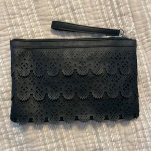Large black clutch with wristlet strap.